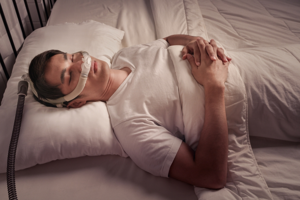 man using CPAP machine